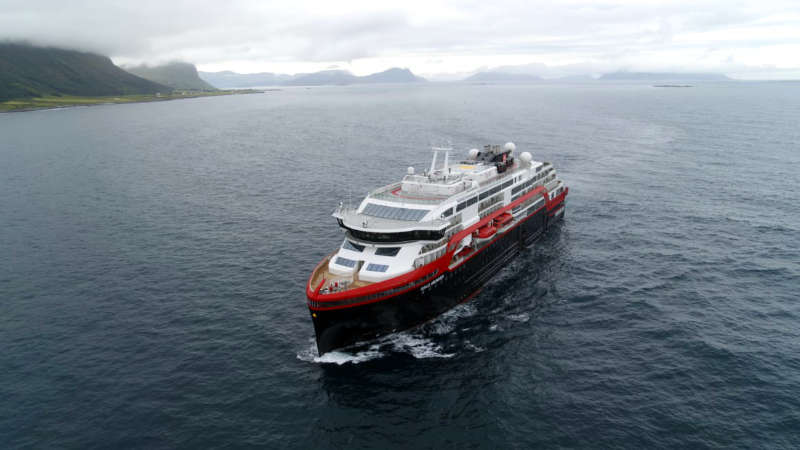 MS Roald Amundsen sailing along the West Coast of Norway.|
