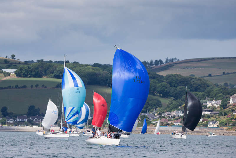 Kieran Collins Olson 30 Coracle IV (Royal Cork YC) leads the fleet under spinnaker. David Branigan/Oceansport
