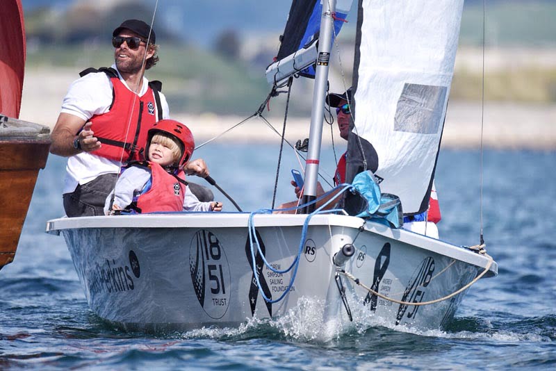 Local sailing clubs join thousands on the water to remember Olympic sailor