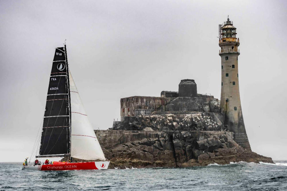 VO60 Challenge Ocean (Libertalia) rounds the Fastnet Rock in the 2021 race © ROLEX/Kurt Arrigo